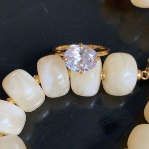 East west diamond solitaire ring